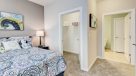 bedroom with carpet and large closet 