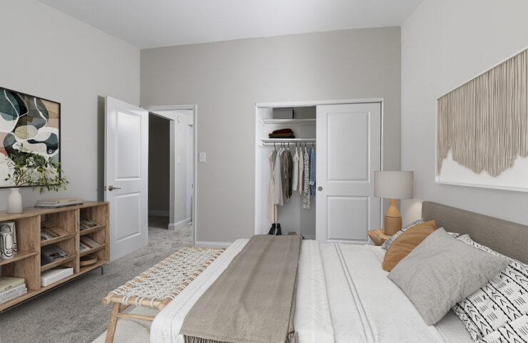 bedroom with wall-to-wall carpet and large closet