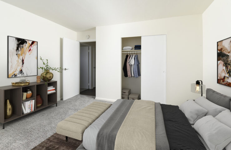 bedroom with carpet and large closet