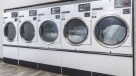 large washer and dryers in laundry room 