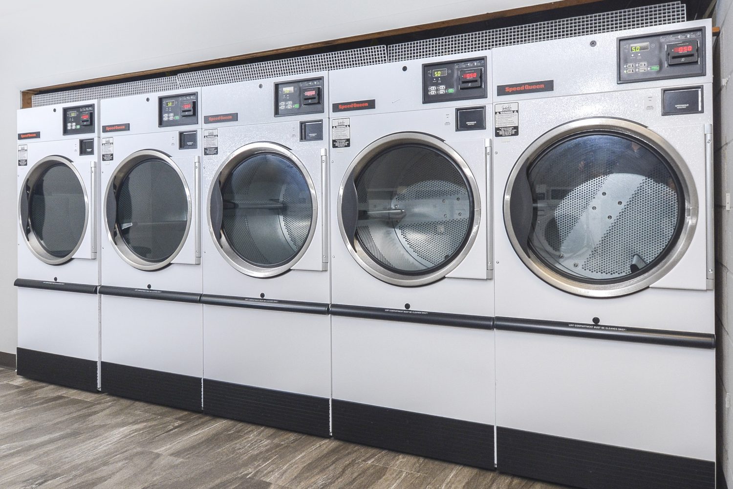 large washer and dryers in laundry room