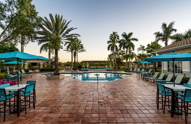 pool with umbrella tables and lounge chairs 