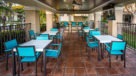 patio seating area with ceiling fans