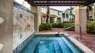 outdoor hot tub with water feature in the wall 