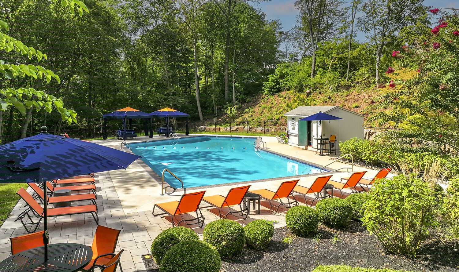 Pool with Lounge Chairs and Umbrella Tables
