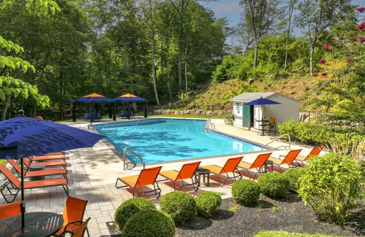 Pool with Lounge Chairs and Umbrella Tables