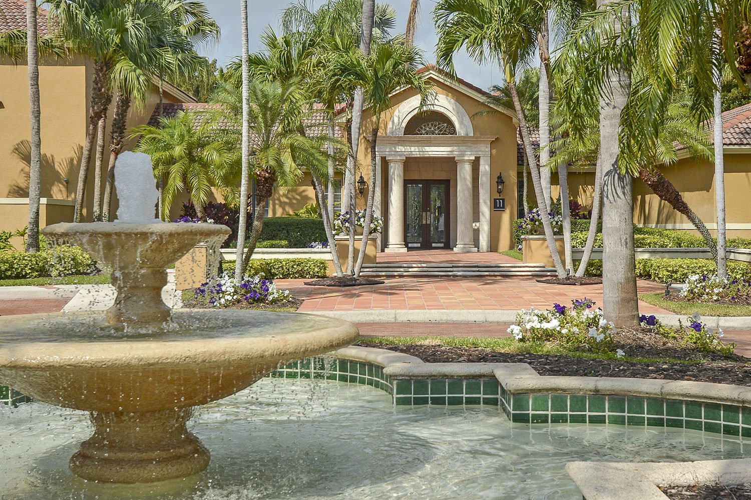 large fountain at entrance of community