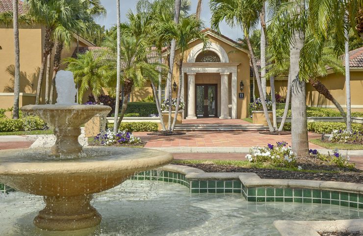 large fountain at entrance of community