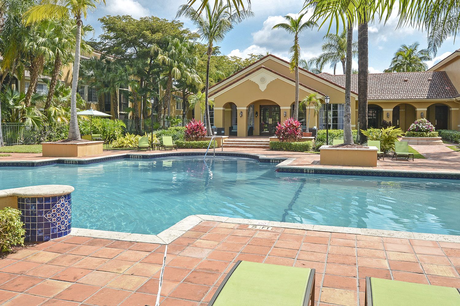 view of the pool with the clubhouse in the background