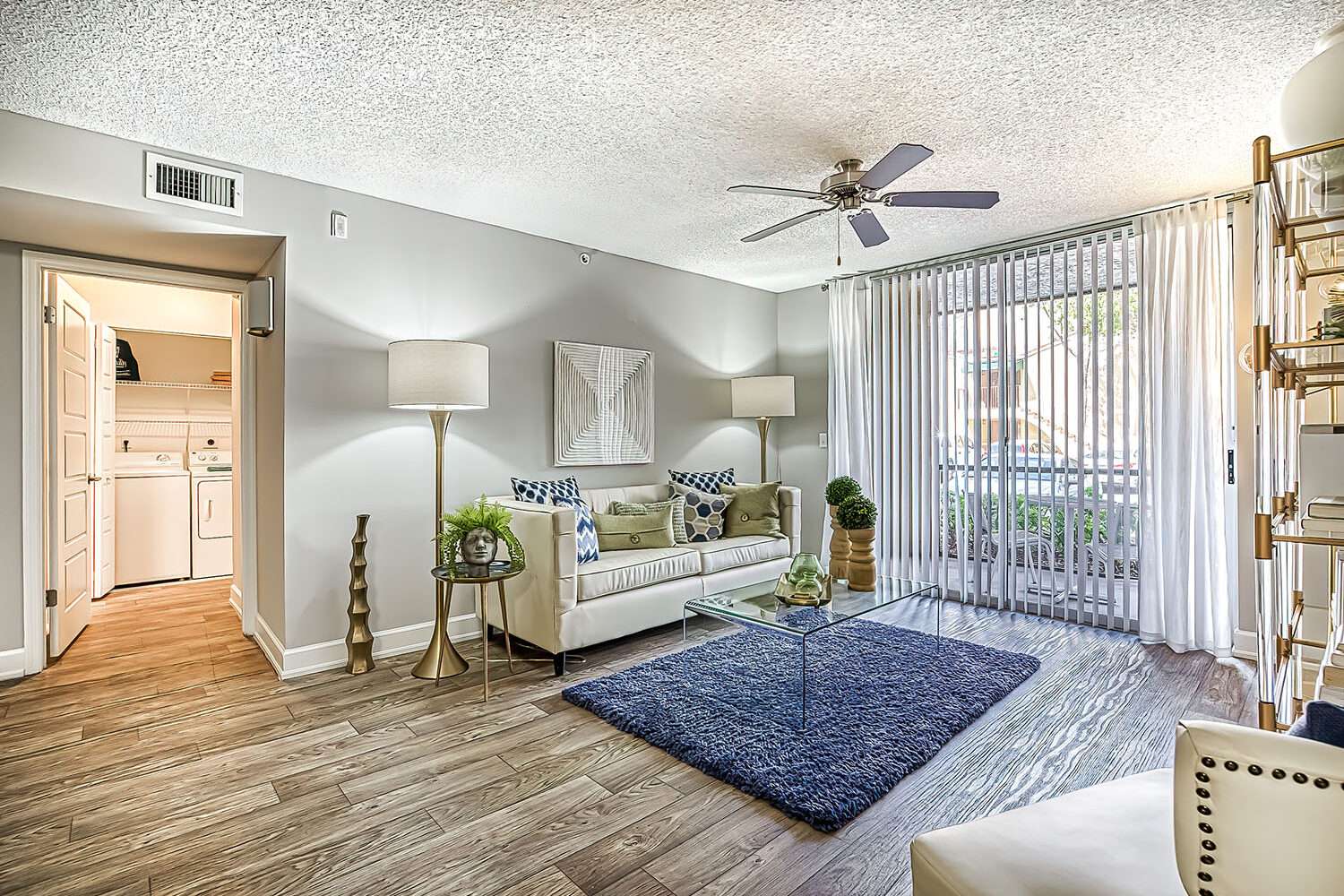 living room with plank flooring and sliding door