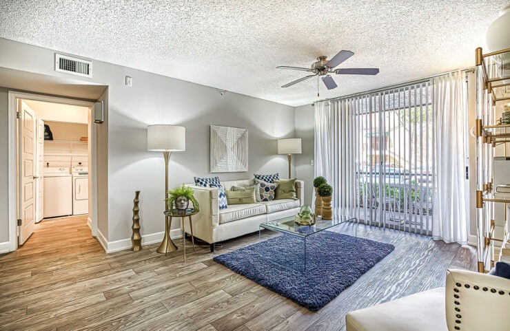 living room with plank flooring and sliding door