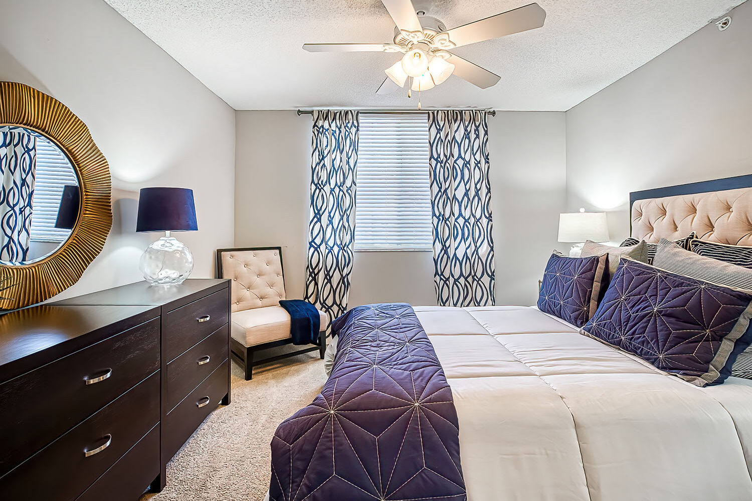 large bedroom with ceiling fan and carpet