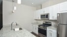 kitchen with white cabinets and granite countertops
