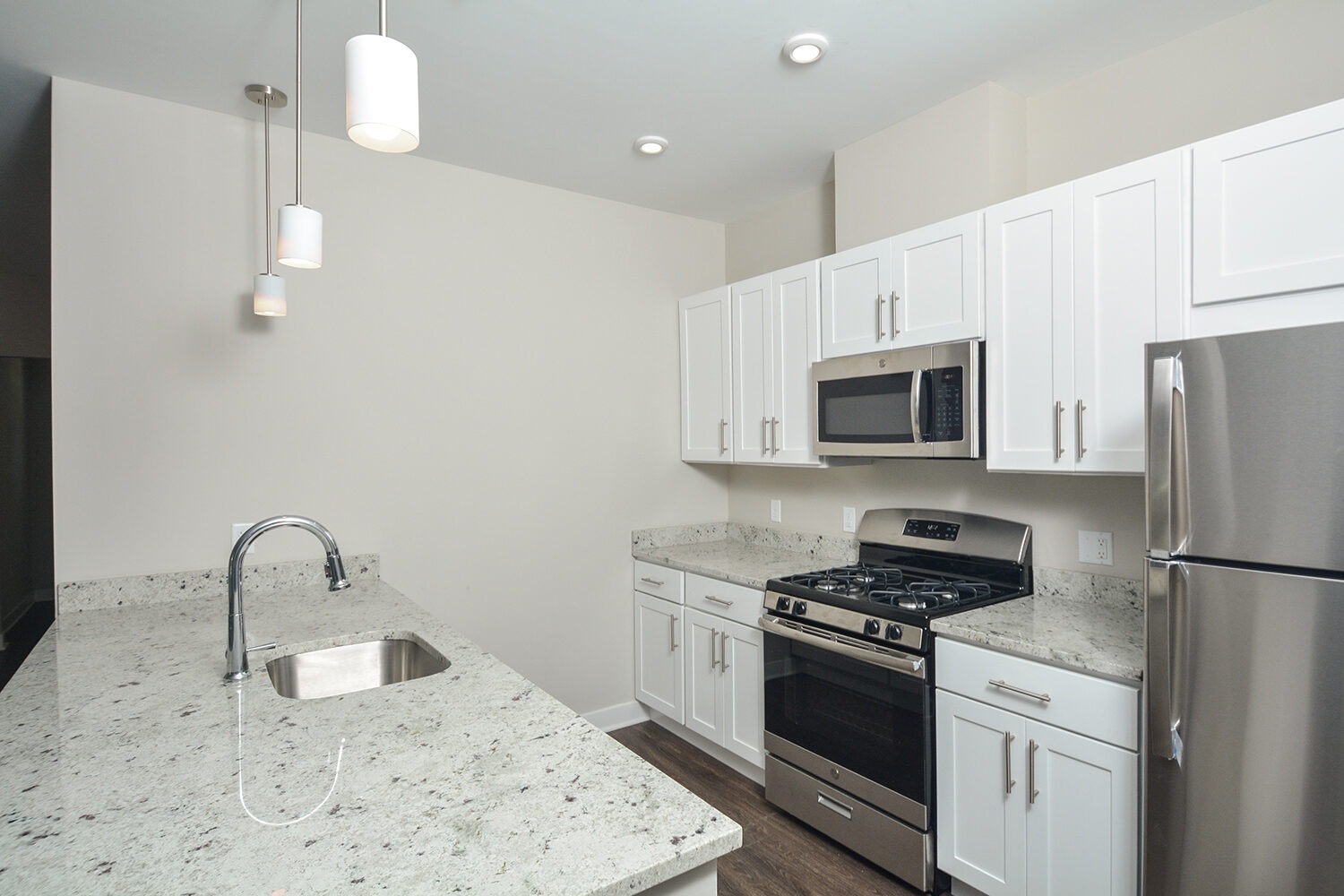 kitchen with white cabinets and granite countertops