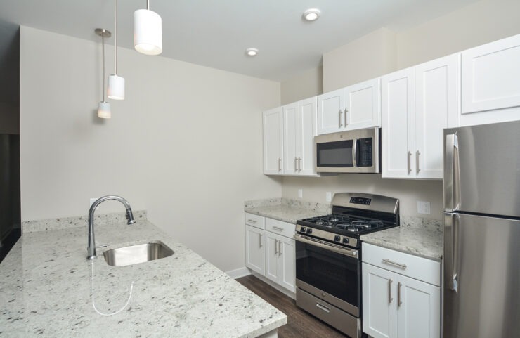 kitchen with white cabinets and granite countertops
