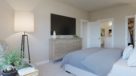 large master bedroom with carpeting 