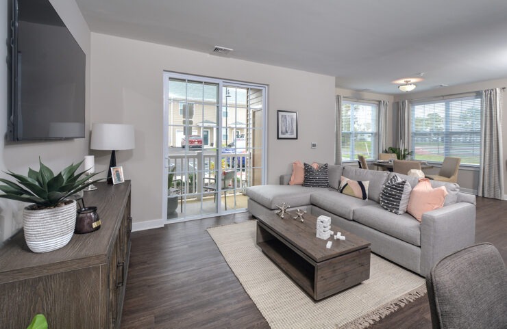 large living room with sliding doors to patio