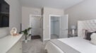 carpeted bedroom with walk in closet