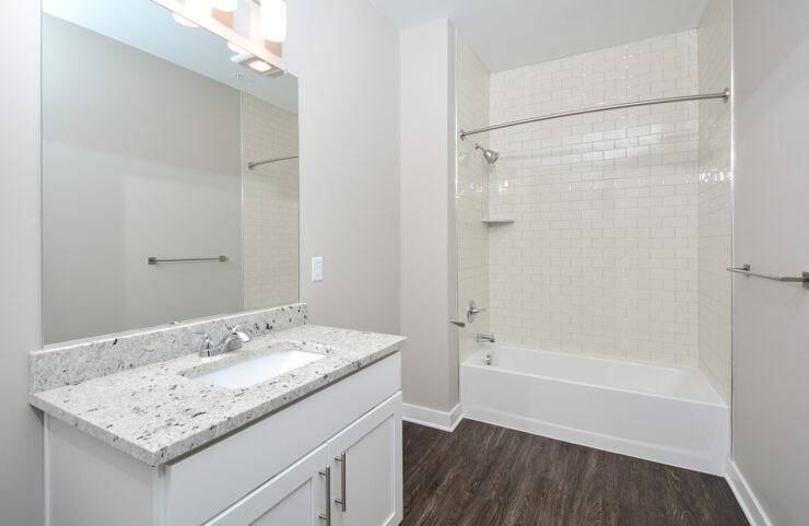 kitchen with tile tub and granite vanity 