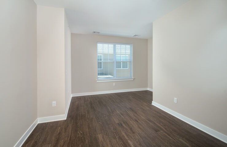 den with plank flooring in select units 
