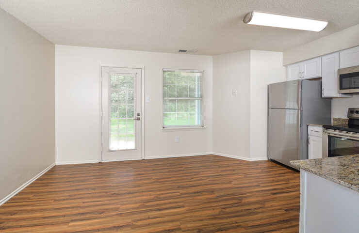 eat-in kitchen with a door leading out to an outdoor patio