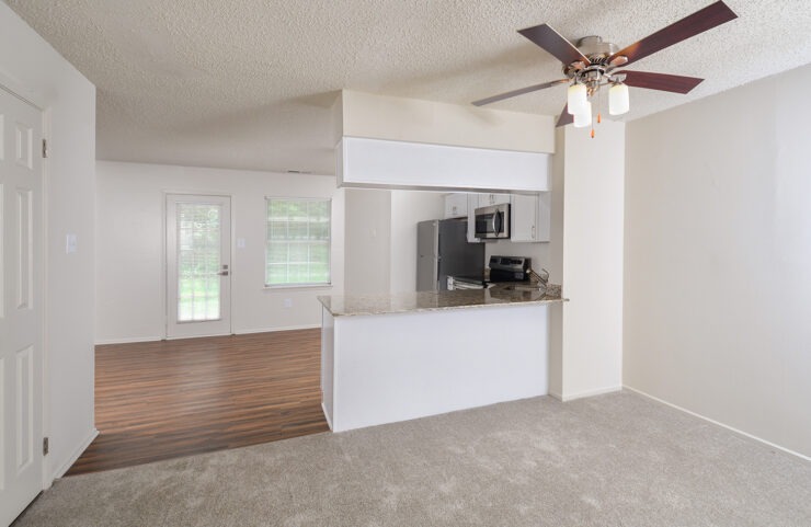carpeted dining area outside the kitchen
