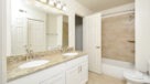upgraded bathroom with double sinks