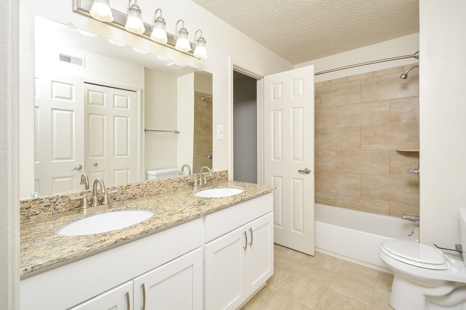 upgraded bathroom with double sinks