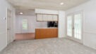 carpeted dining area with access to outside patio 