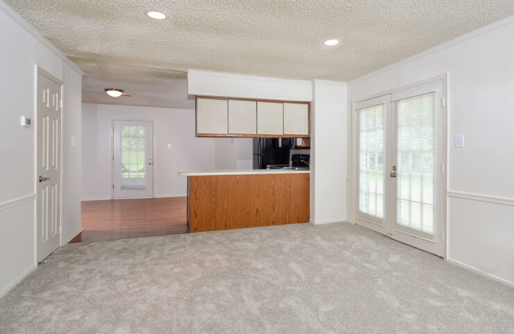 carpeted dining area with access to outside patio 