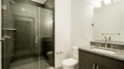 Bathroom With Gorgeous Glass and Porcelain Tiled Showers