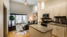 Modern Kitchen With Stainless Steel Appliances, Granite Countertops and Designer Lighting