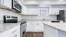 upgraded kitchen with white and gray granite countertops