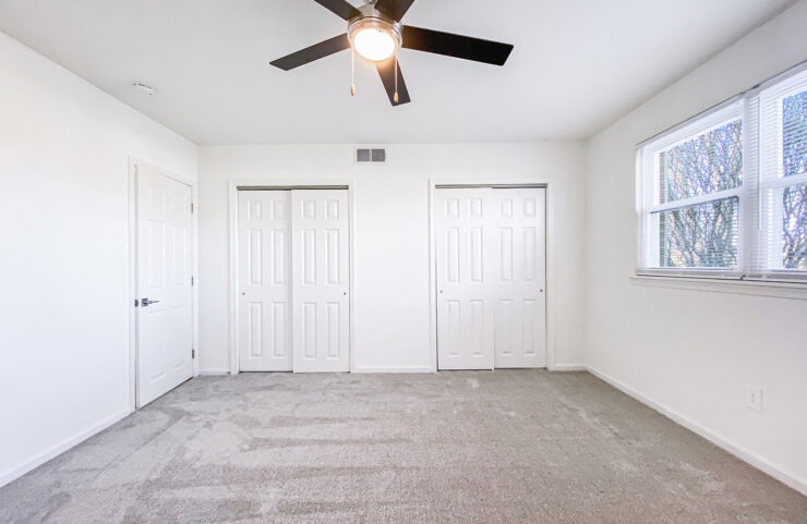 bedroom with two large closets