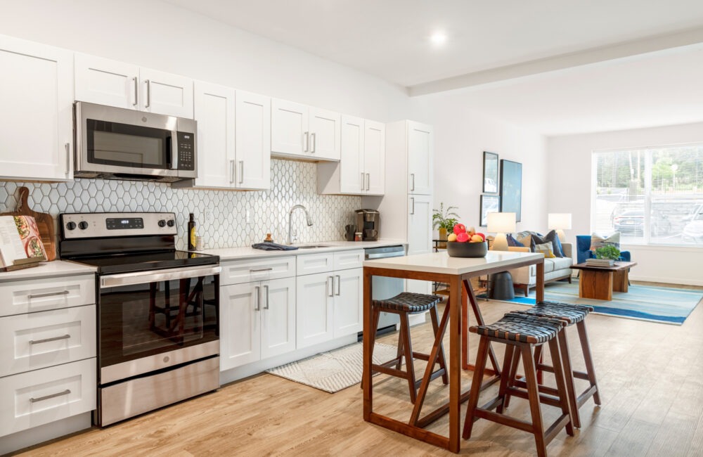 kitchen with white cabinets and plank flooring
