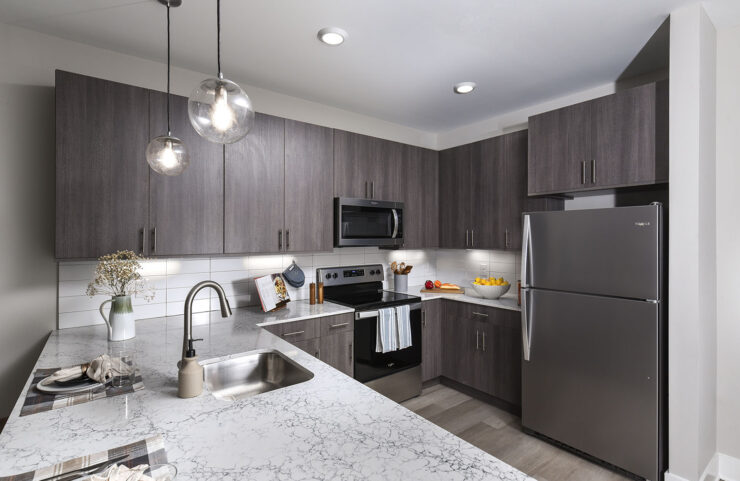 Euroline natural grain style cabinetry, featuring under-cabinet lighting