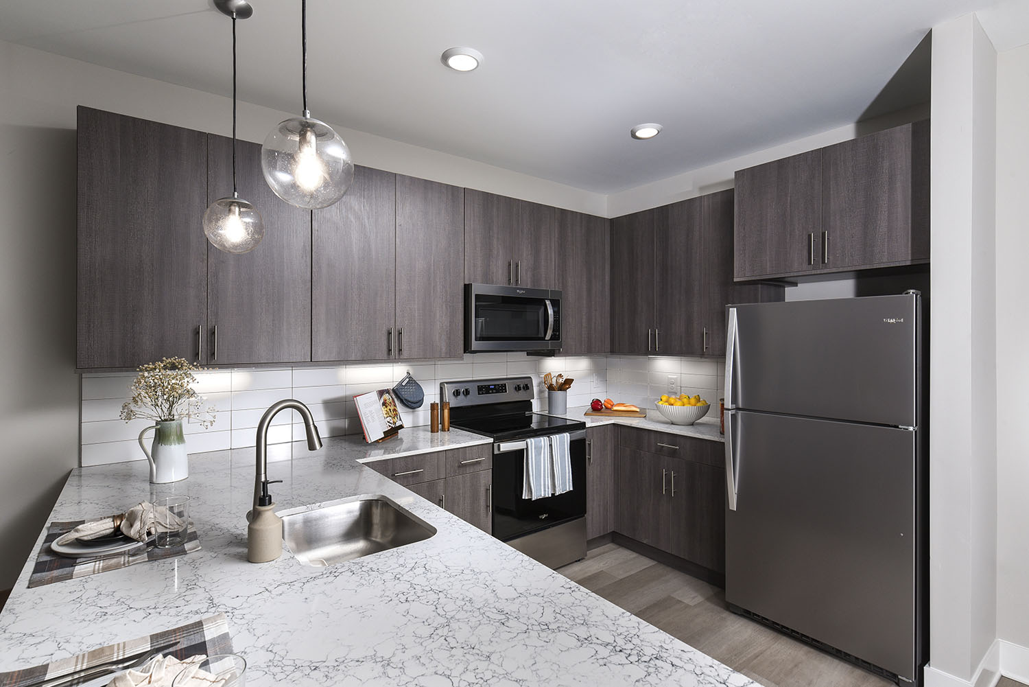 Euroline natural grain style cabinetry, featuring under-cabinet lighting