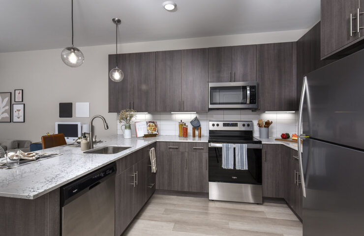 Unique Pendant Lighting Over Kitchen Peninsula