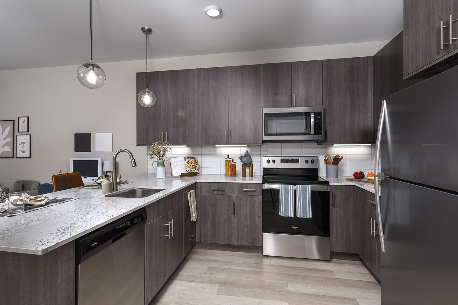 Unique Pendant Lighting Over Kitchen Peninsula