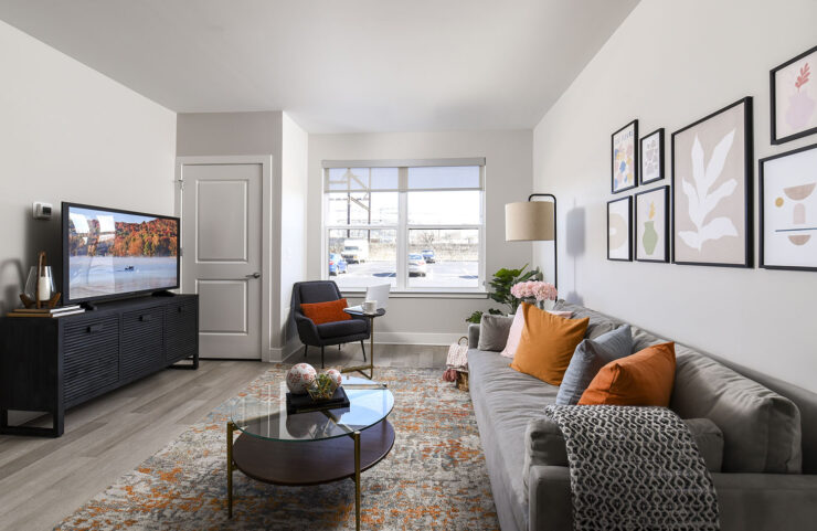 Large living room with plank flooring