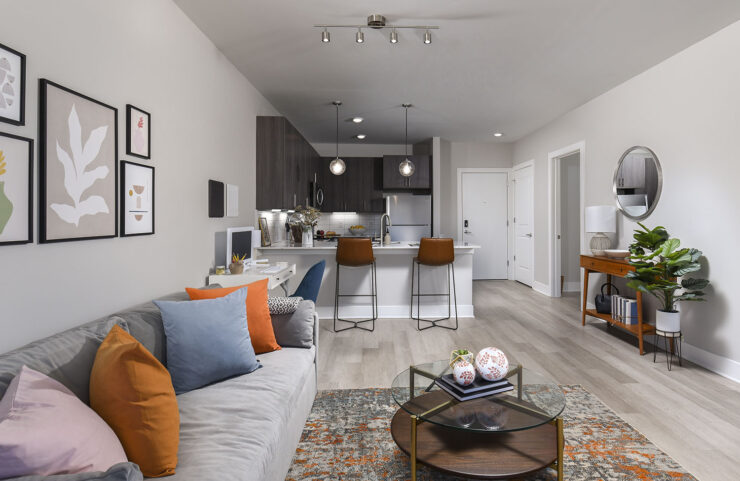open layout showing living area and kitchen with breakfast bar