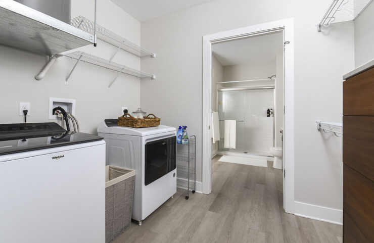 Large laundry room with shelving 