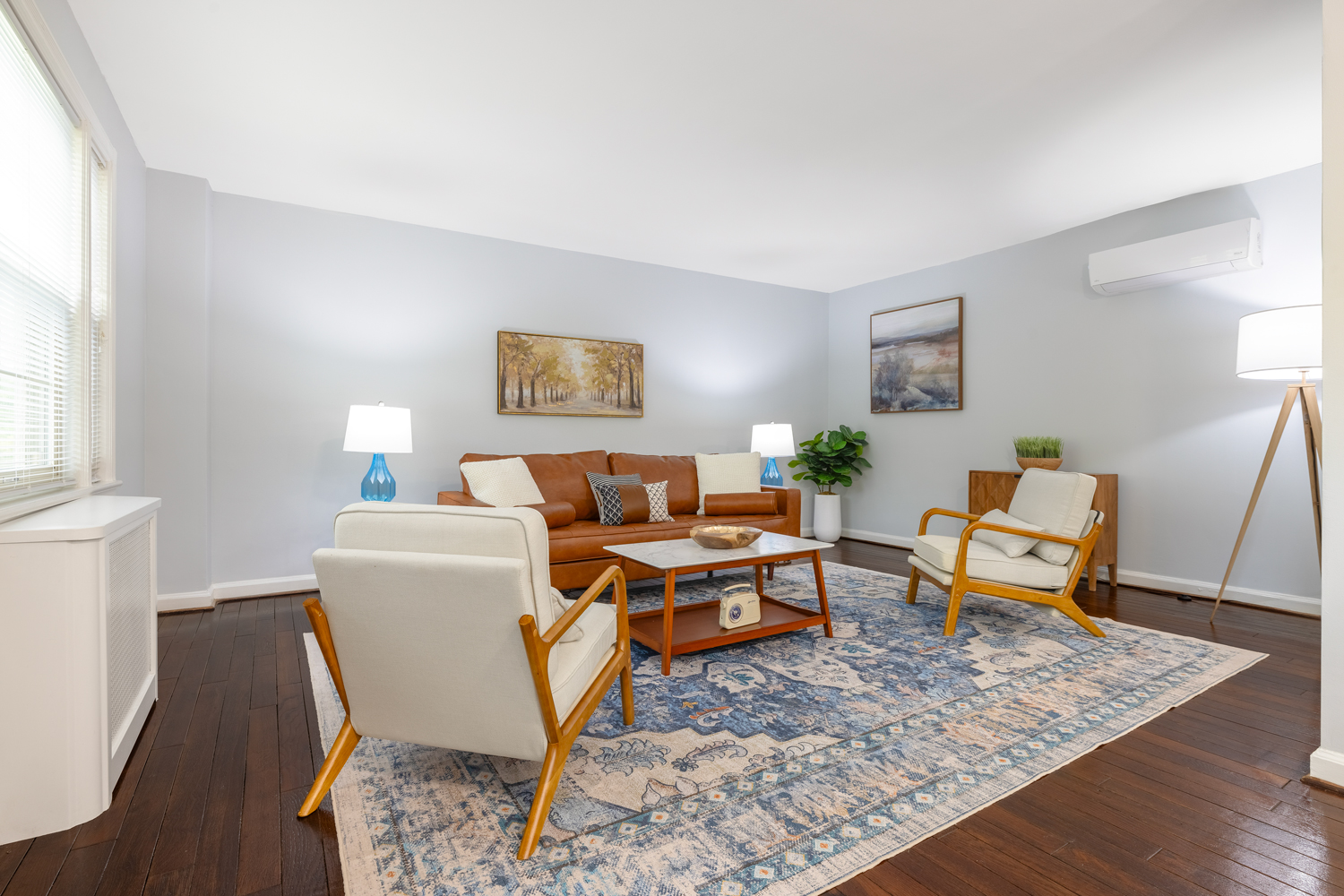 large living room with plank floorin