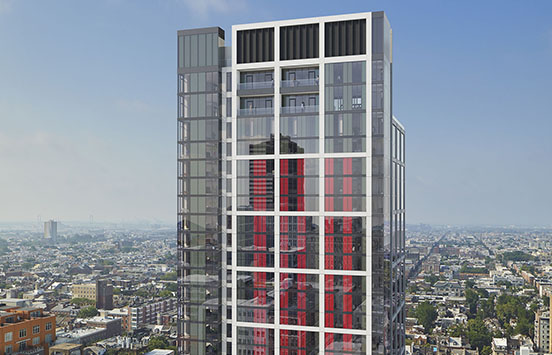 Beautiful glass high rise apartment building with red accents in the center of Philadelphia