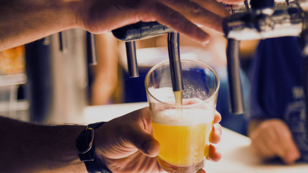 Bartender pouring beer from a tap