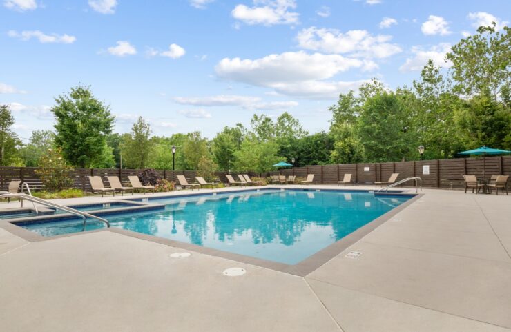 Resort style swimming pool with sun shelf and hot tub