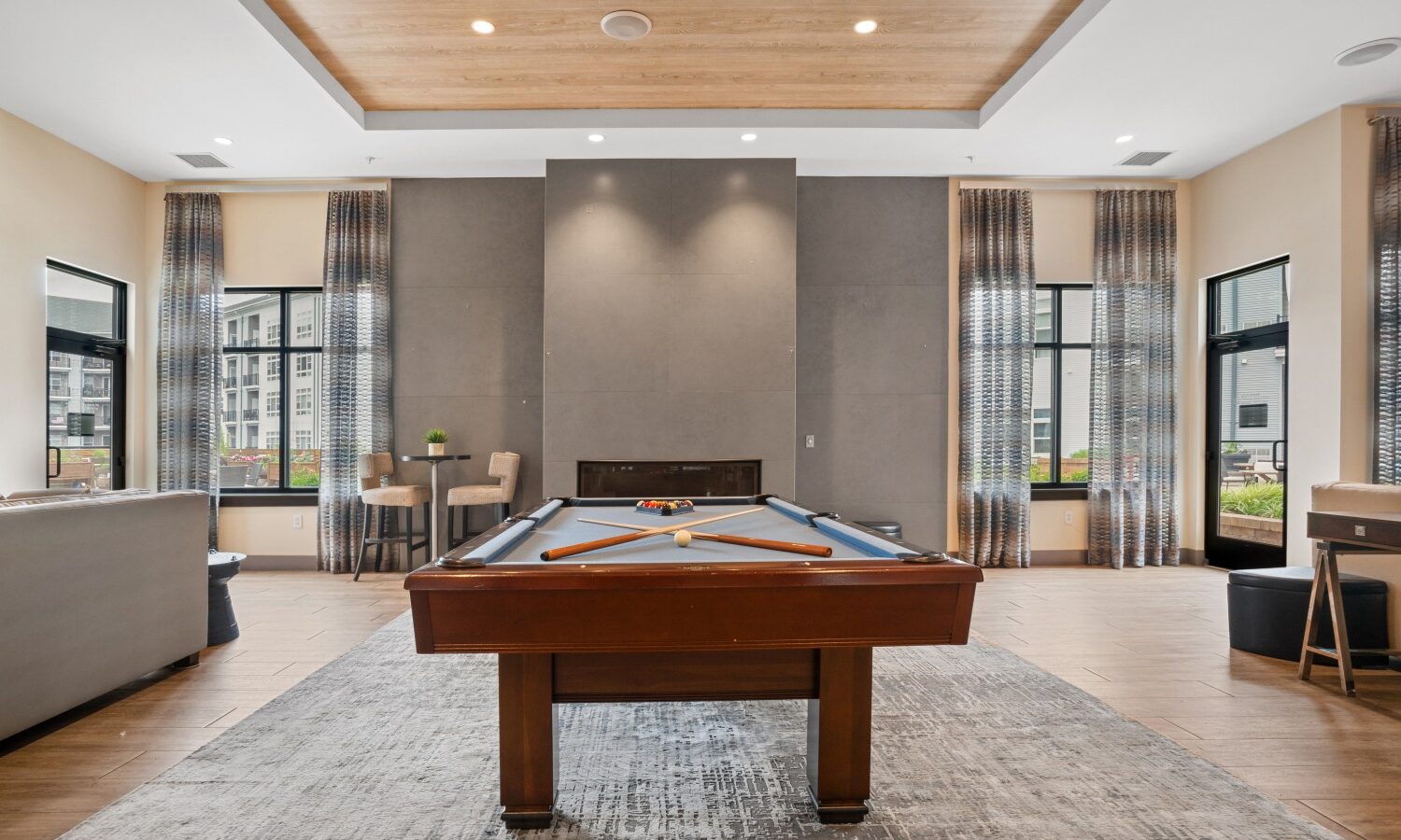 Sophisticated resident lounge with HDTVs, billiards and fireplace