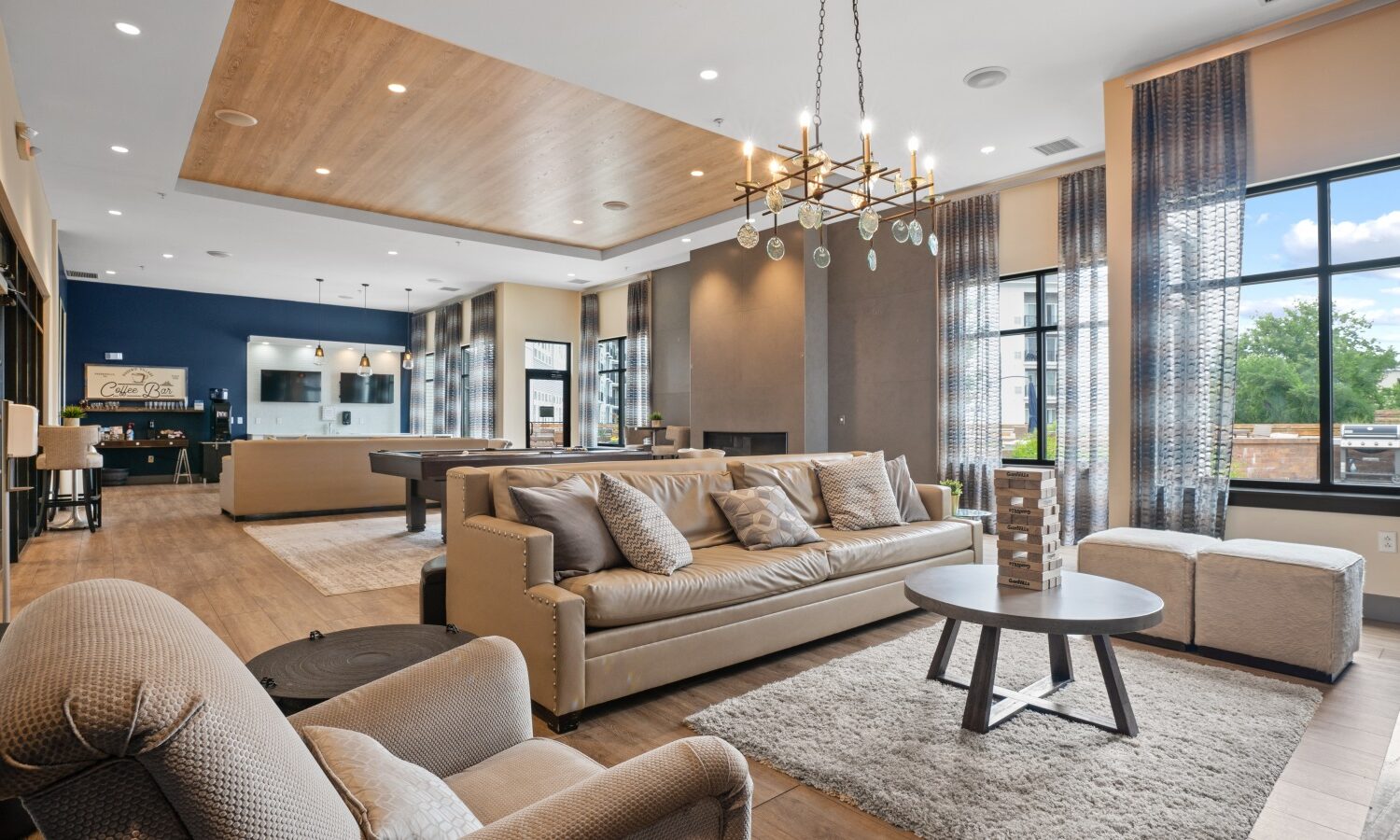 Sophisticated resident lounge with HDTVs, billiards and fireplace