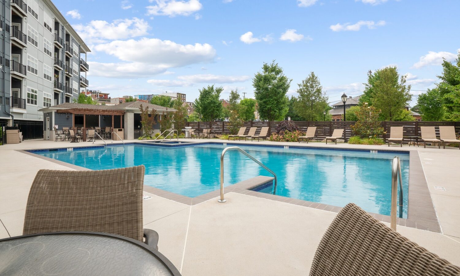 Resort style swimming pool with sun shelf and hot tub