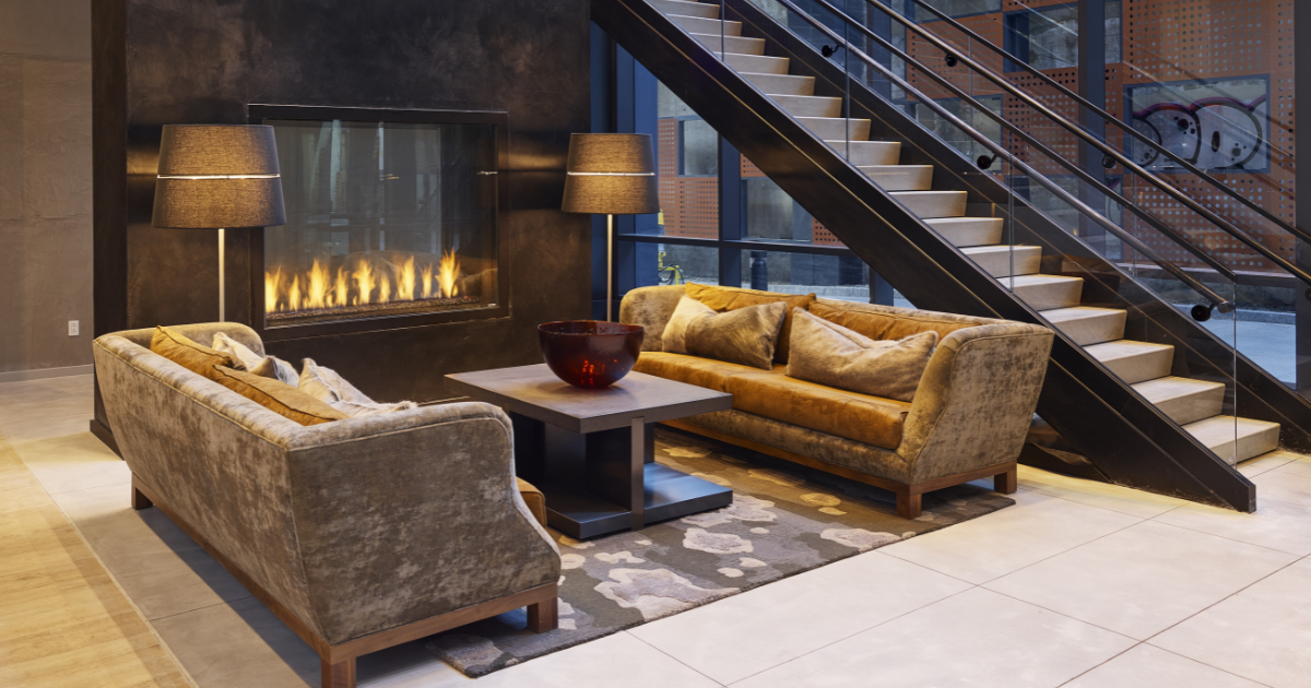 1213 Walnut lobby with couches and a fireplace